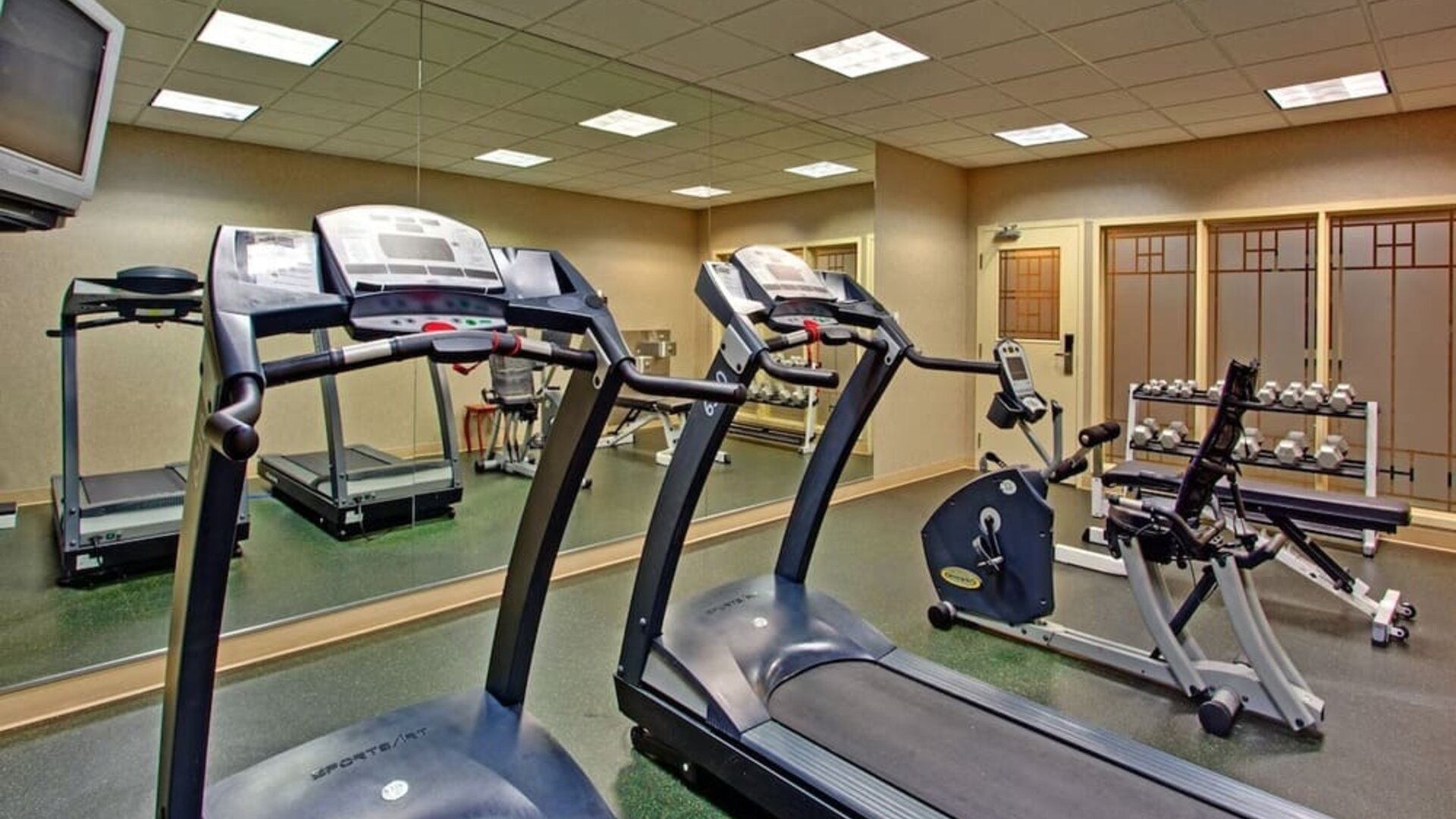 Well equipped fitness center at Holiday Inn Express & Suites Medicine Hat.
