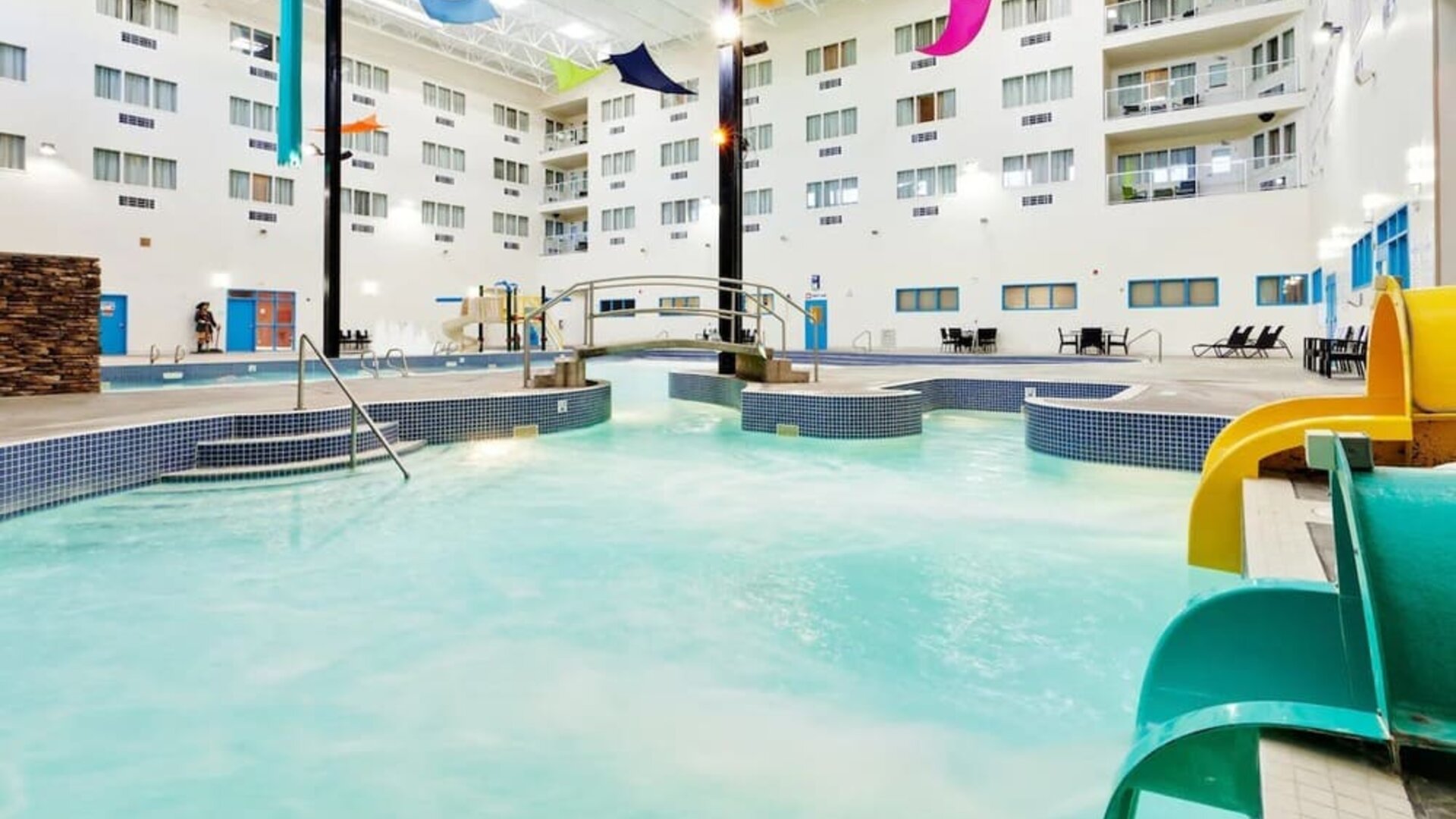 Indoor pool with water slides at Holiday Inn Lethbridge. 