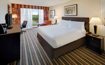 Day use room with balcony and work desk at Holiday Inn Orlando SW - Celebration Area.