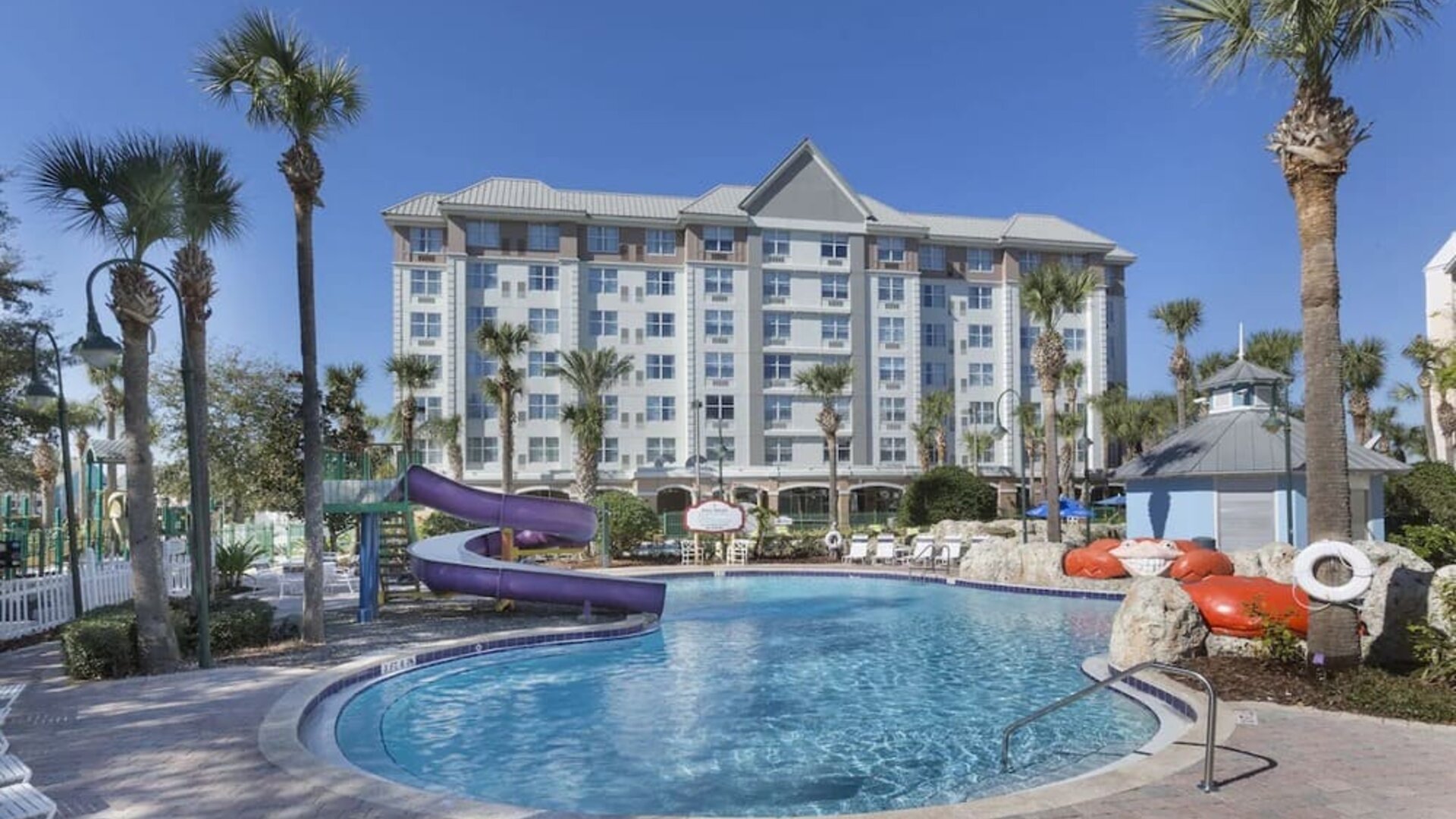 Refreshing outdoor pool with slide at Holiday Inn Express & Suites S Lake Buena Vista.