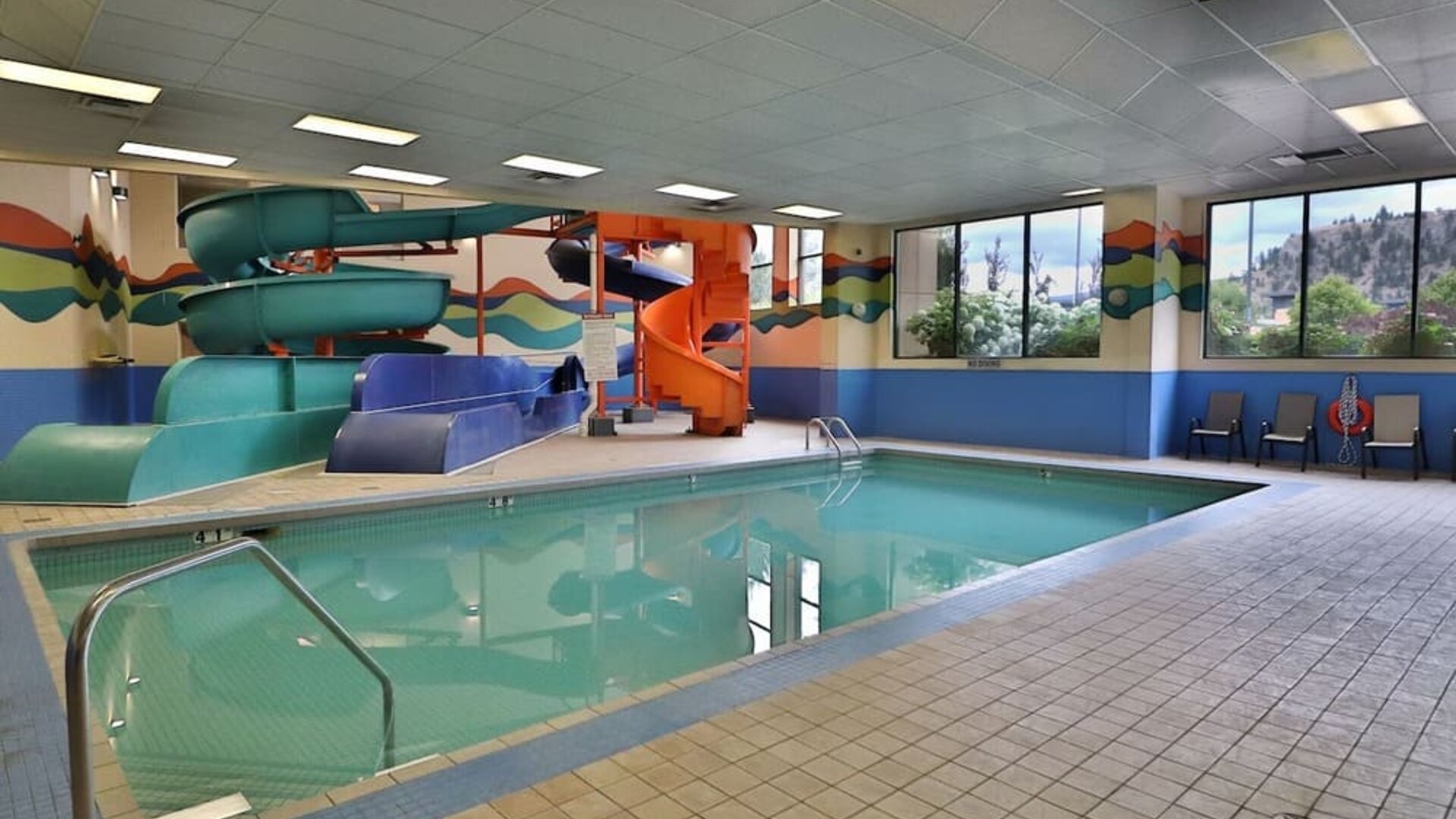 Interior pool with water slides at Kanata Kelowna And Conference Centre. 