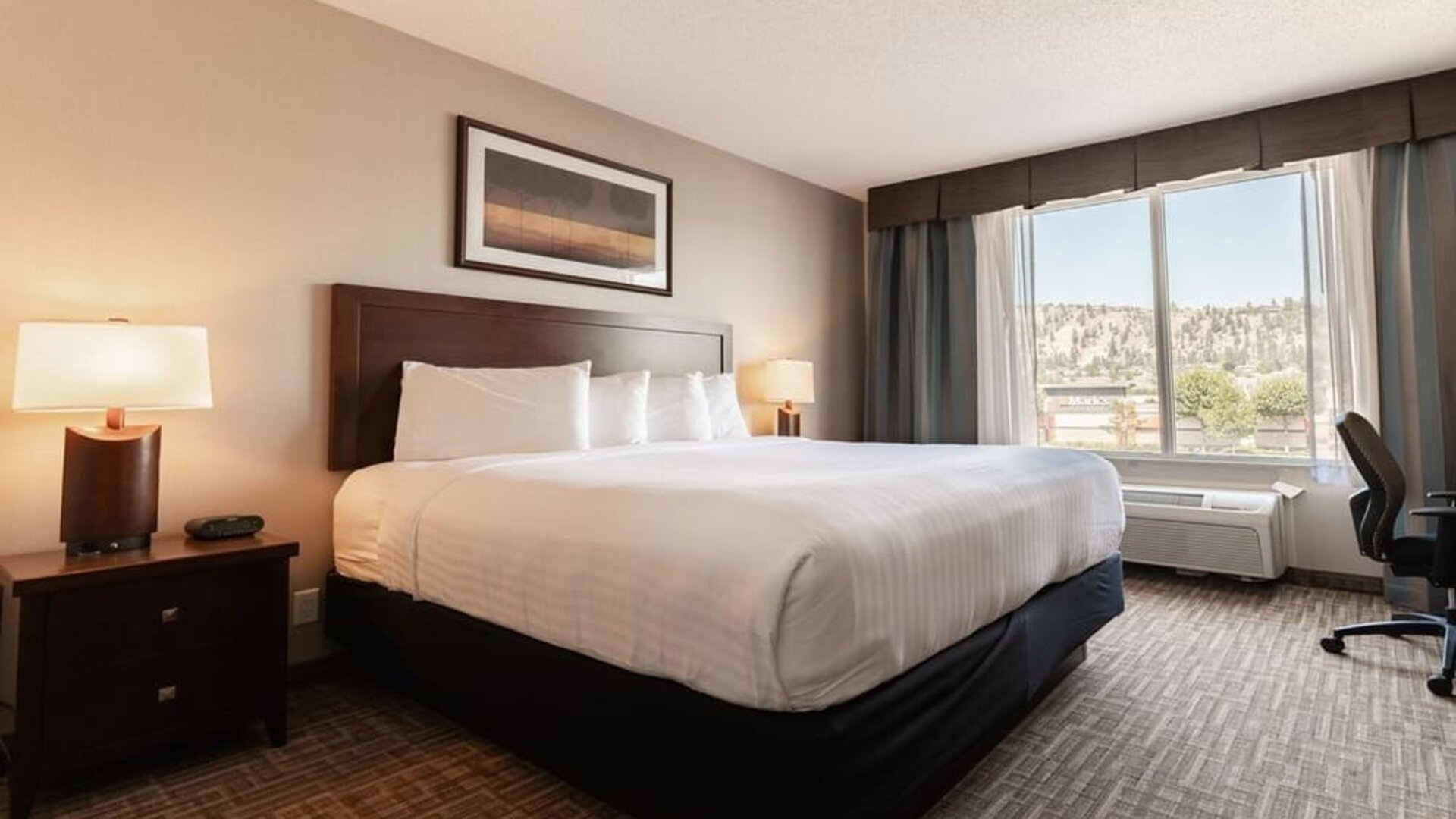 Day use room with work desk and private bathroom at Kanata Kelowna And Conference Centre.