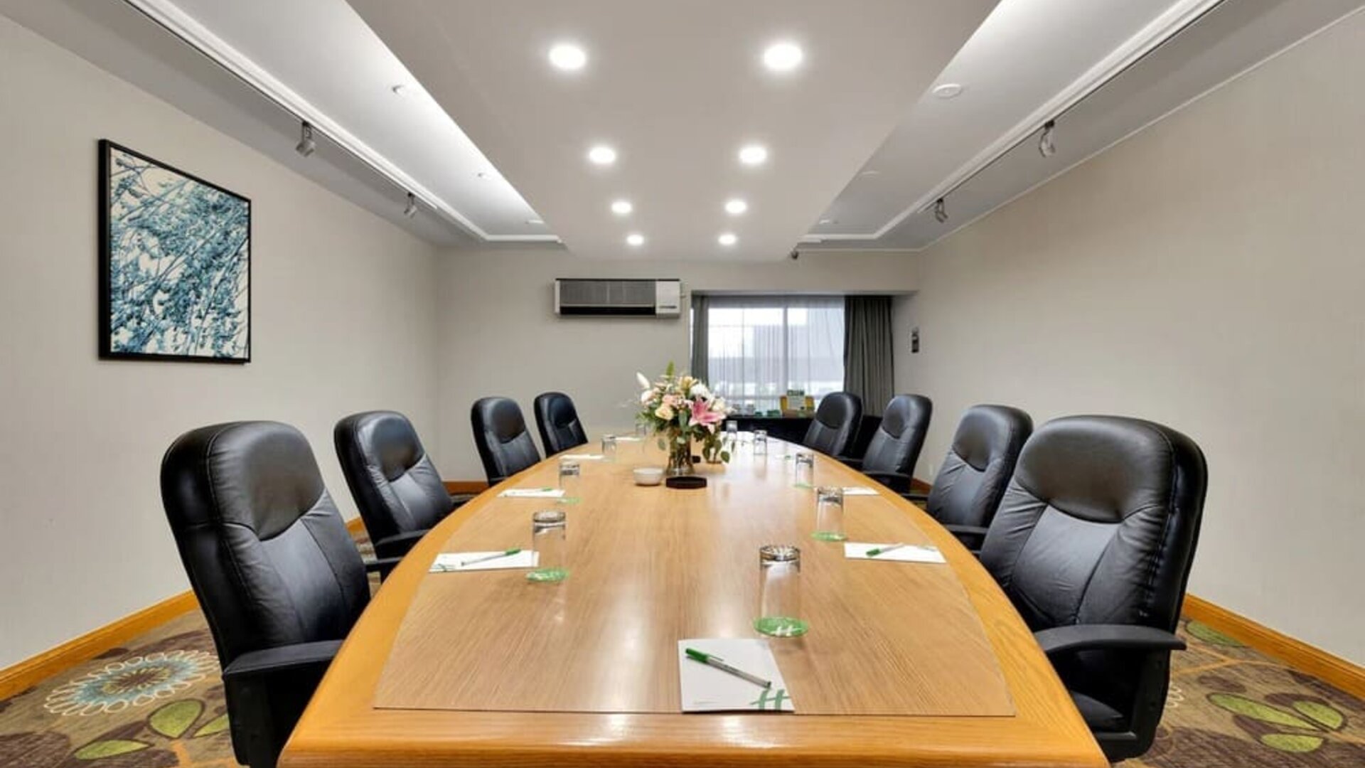 Professional meeting room with ergonomic chairs at Holiday Inn Peterborough-Waterfront.
