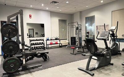 Fully equipped fitness center at Divya Sutra Plaza & Conference Centre.