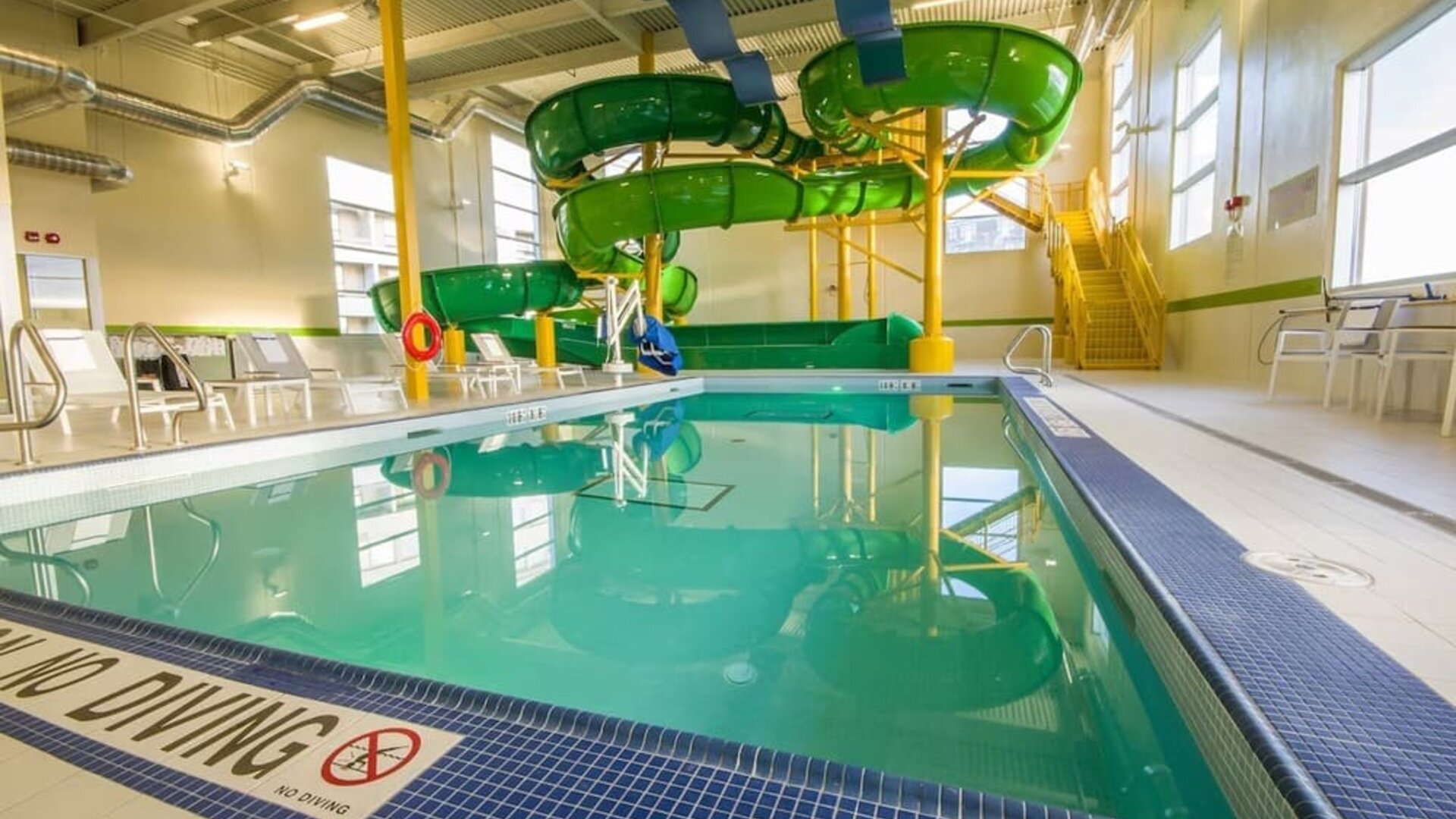 Interior heated pool with waterslides at Holiday Inn St. John's Conference Centre.