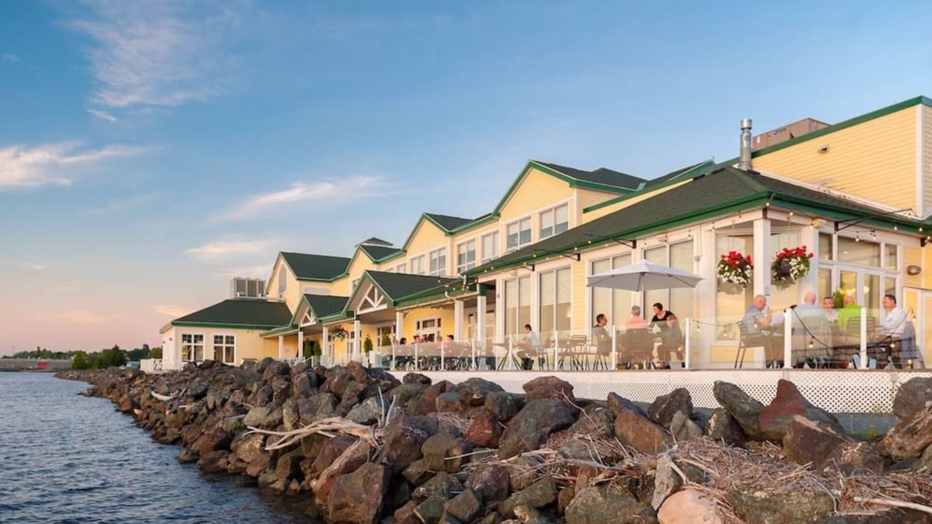 Beautiful hotel terrace with dining area at Rodd Miramichi River.