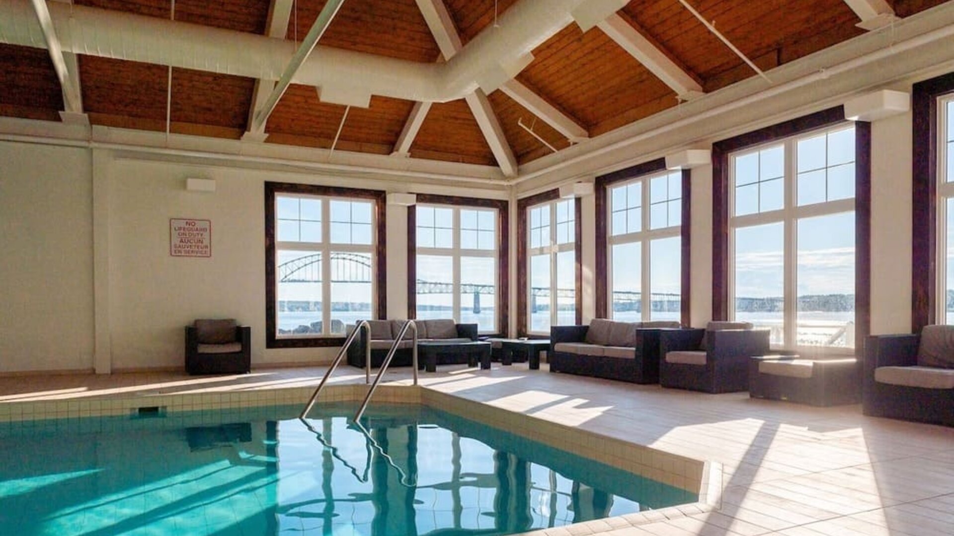 Indoor heated pool with lounge sitting at Rodd Miramichi River.