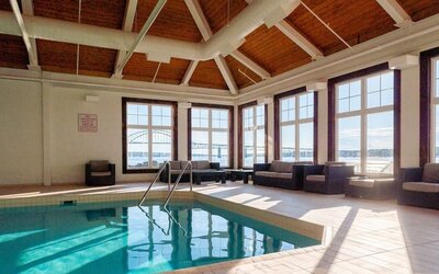 Indoor heated pool with lounge sitting at Rodd Miramichi River.