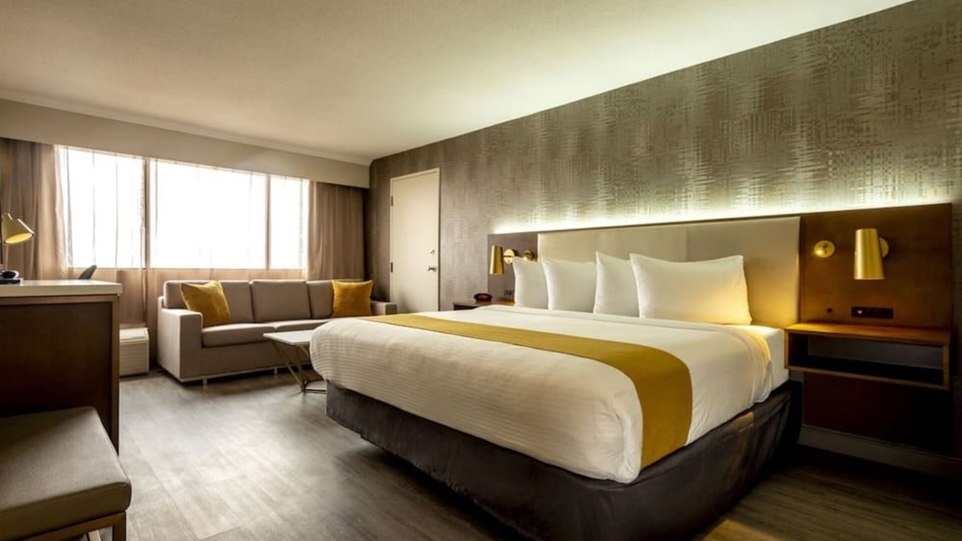 Bright and spacious day use room with lounge area and work desk at Atlantica Hotel Halifax.