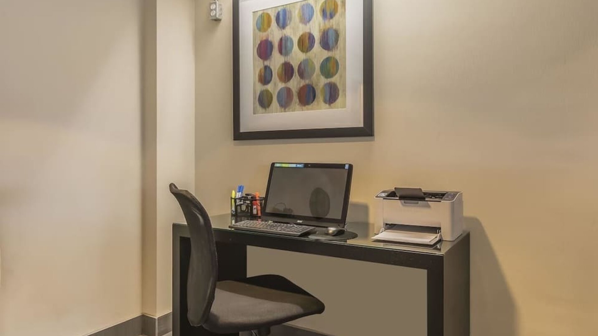 Business center with computer, printer and ergonomic chair at Comfort Inn Belleville.