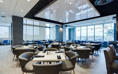 Stylish dining area at Embassy Suites By Hilton Toronto Airport.