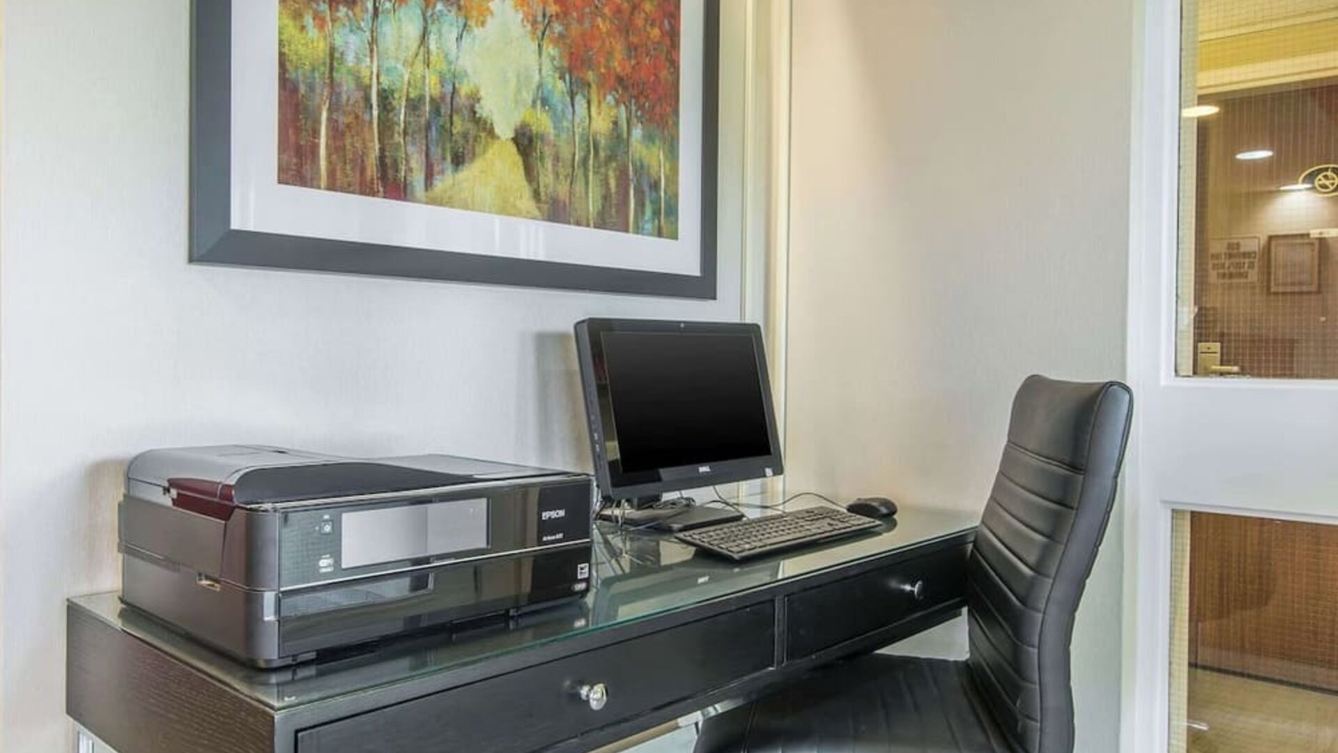 Business center with computer, printer and ergonomic chair at Comfort Inn Moncton Magnetic Hill.