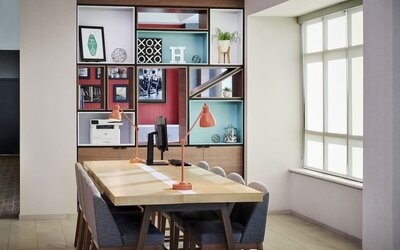 Business center with computer, printer and comfortable seating at Holiday Inn & Suites Oakville At Bronte.