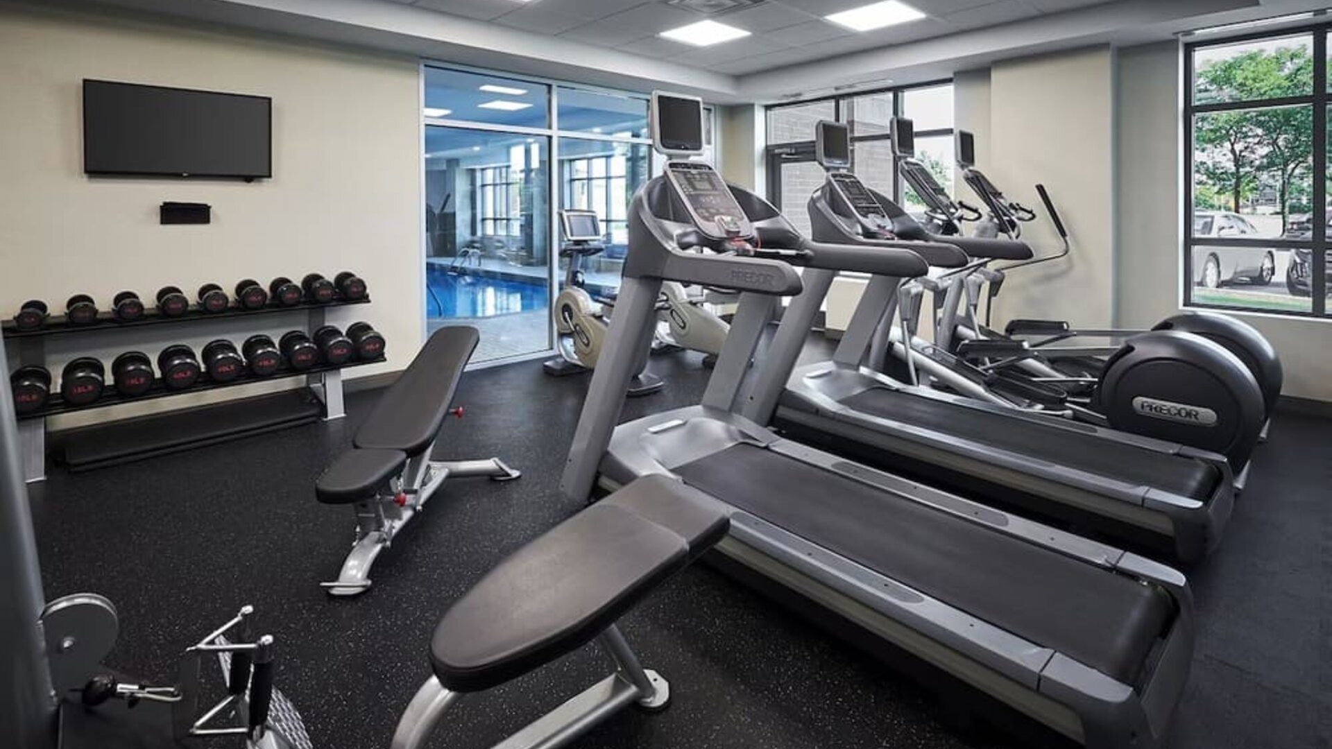 Fully equipped fitness center at Holiday Inn & Suites Oakville At Bronte.