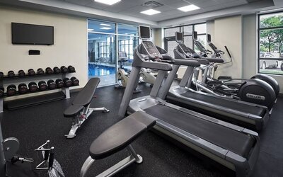 Fully equipped fitness center at Holiday Inn & Suites Oakville At Bronte.