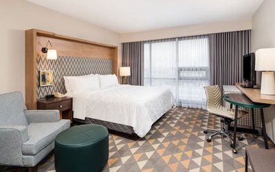 Day use room with work desk and sofa at Holiday Inn Toronto Airport East.