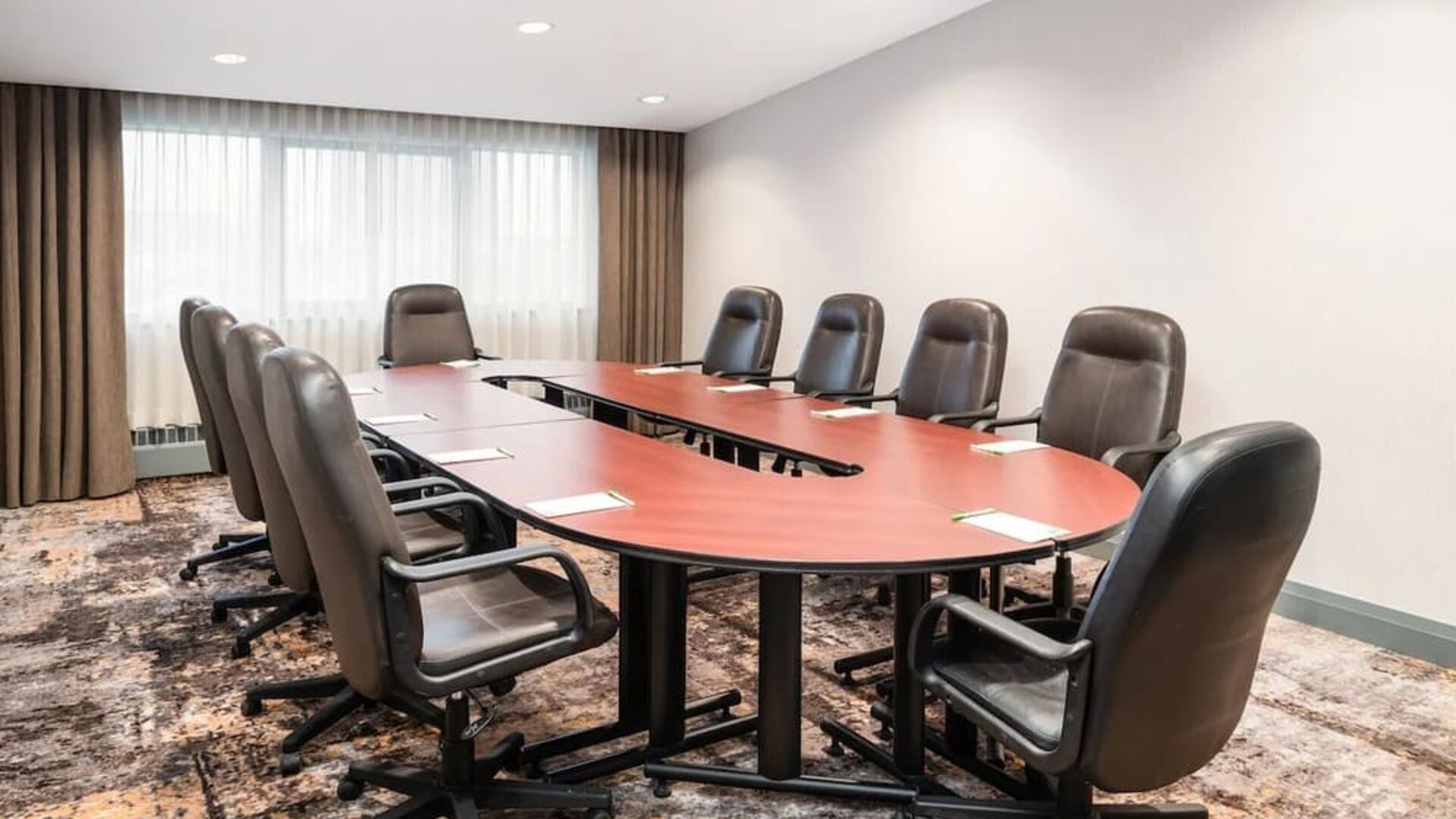 Professional meeting room with ergonomic chairs at Holiday Inn Toronto Airport East.