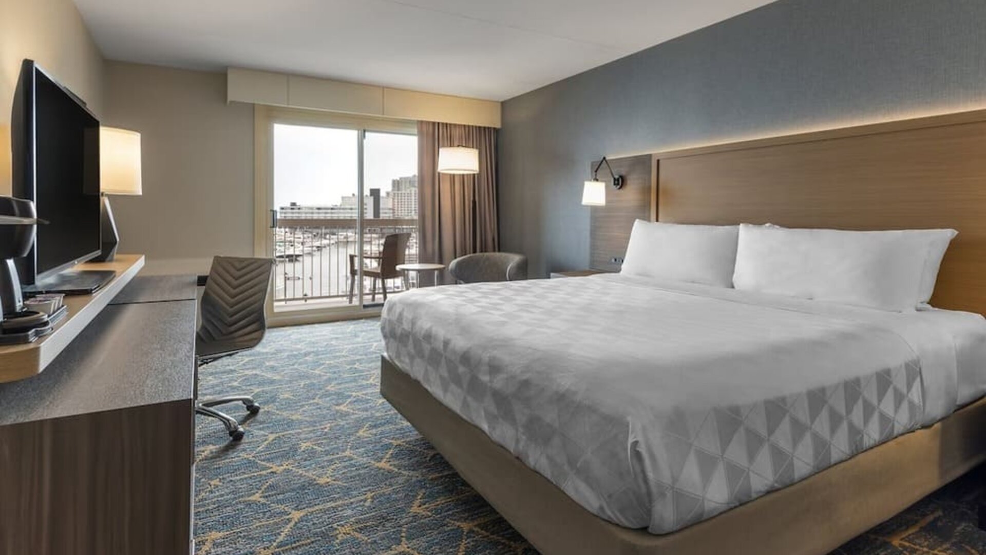 Standard day use room with work desk and balcony at Holiday Inn Kingston Waterfront.