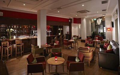 Hotel bar with lounge seating at Thistle Royal Trafalgar Square.