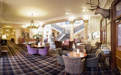 The Royal Highland Hotel’s lobby lounge has armchairs and coffee tables, perfect for co-working.