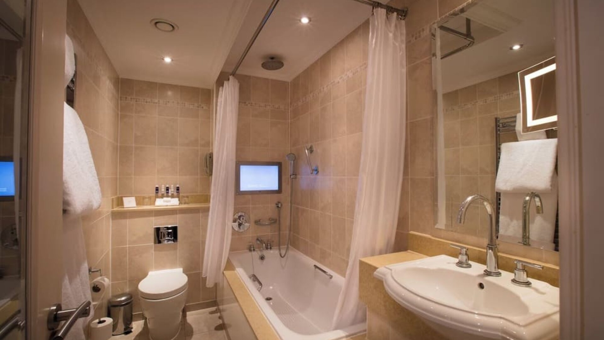 Guest bathroom with tub at The Royal Horseguards Hotel.