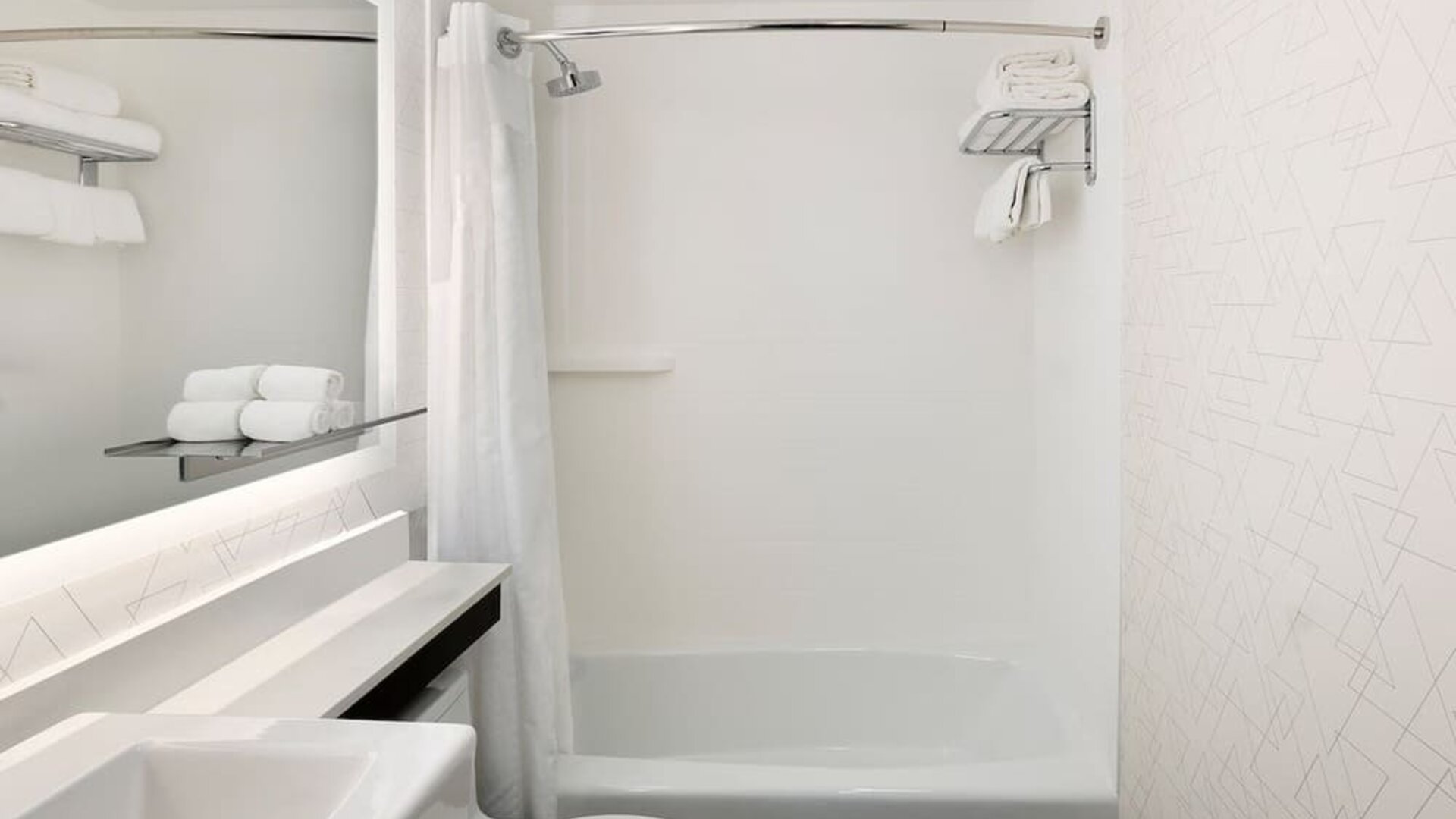 Guest bathroom with shower and tub at Holiday Inn Express New York City - Chelsea.