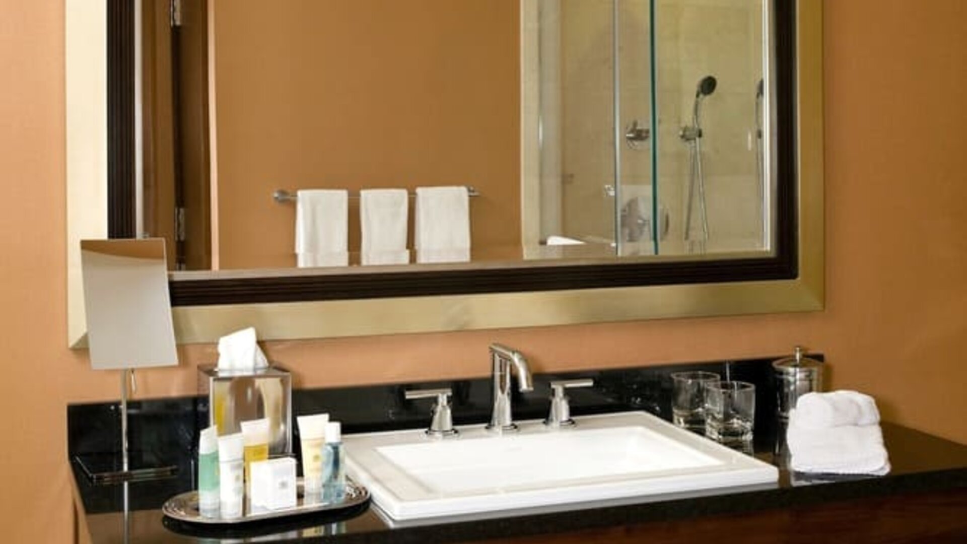 Guest bathroom with shower at The Bostonian Boston, A Millennium Hotel.