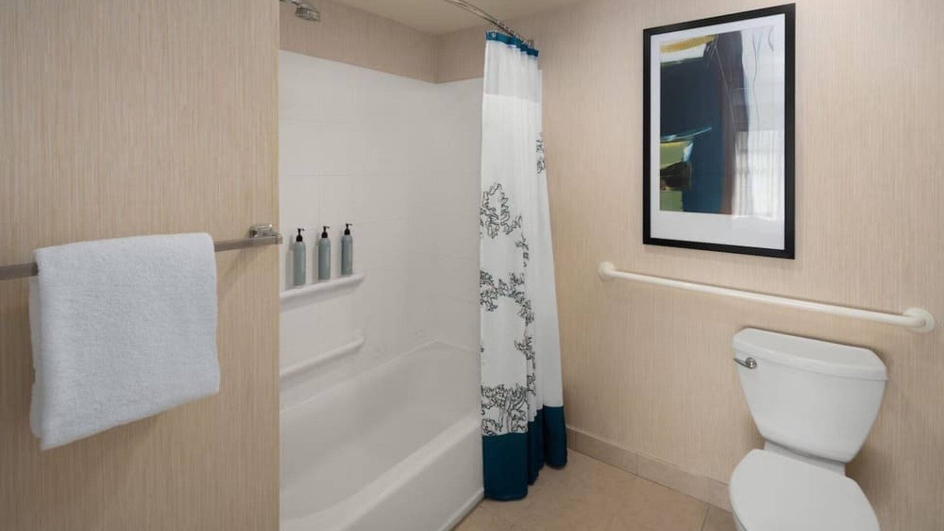 Guest bathroom with shower and tub at Residence Inn By Marriott Portland Airport At Cascade Station.