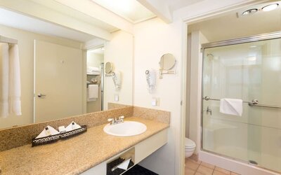 Guest bathroom with shower at The Marina Inn On San Francisco Bay.