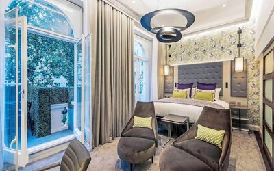 Day use suite with lounge seating and work desk at Mercure Hotel London Hyde Park.