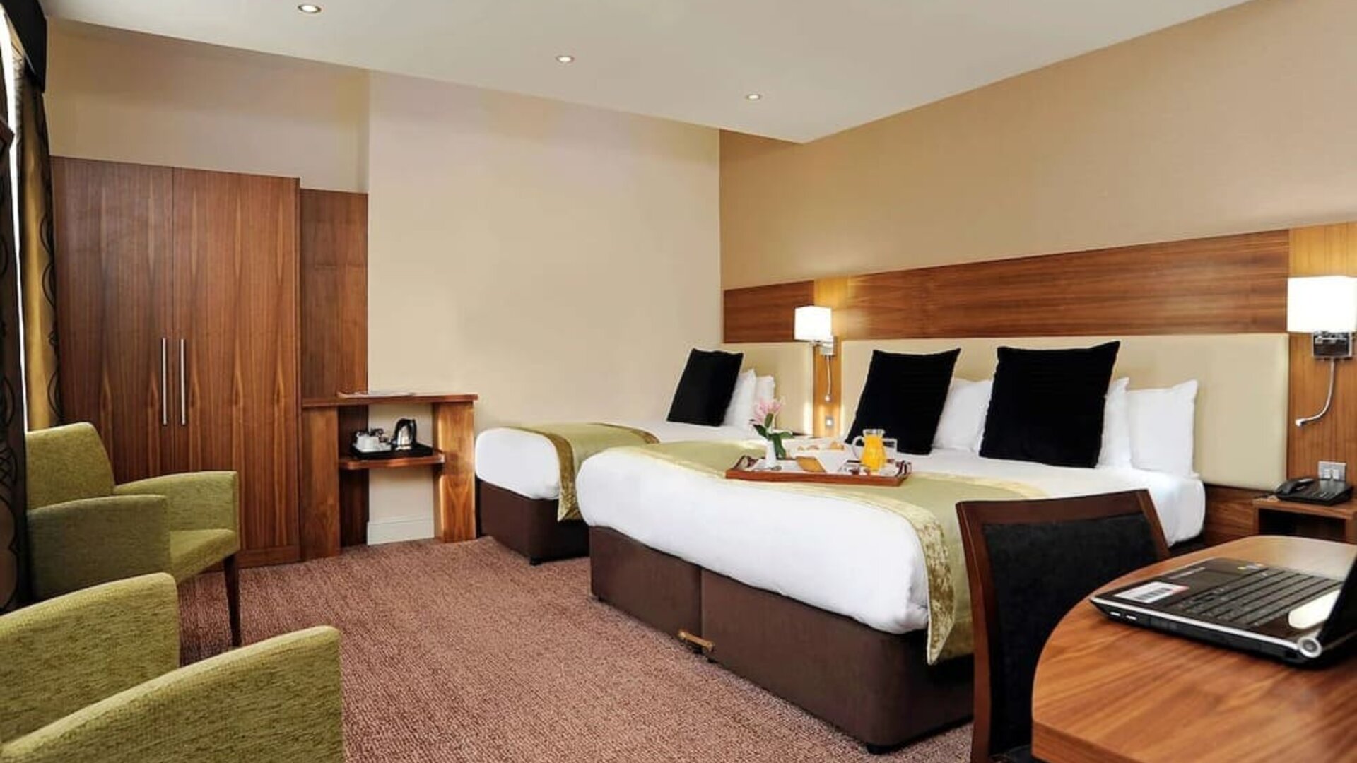 Day use twin room with work desk and lounge seating at Mercure London Bloomsbury.