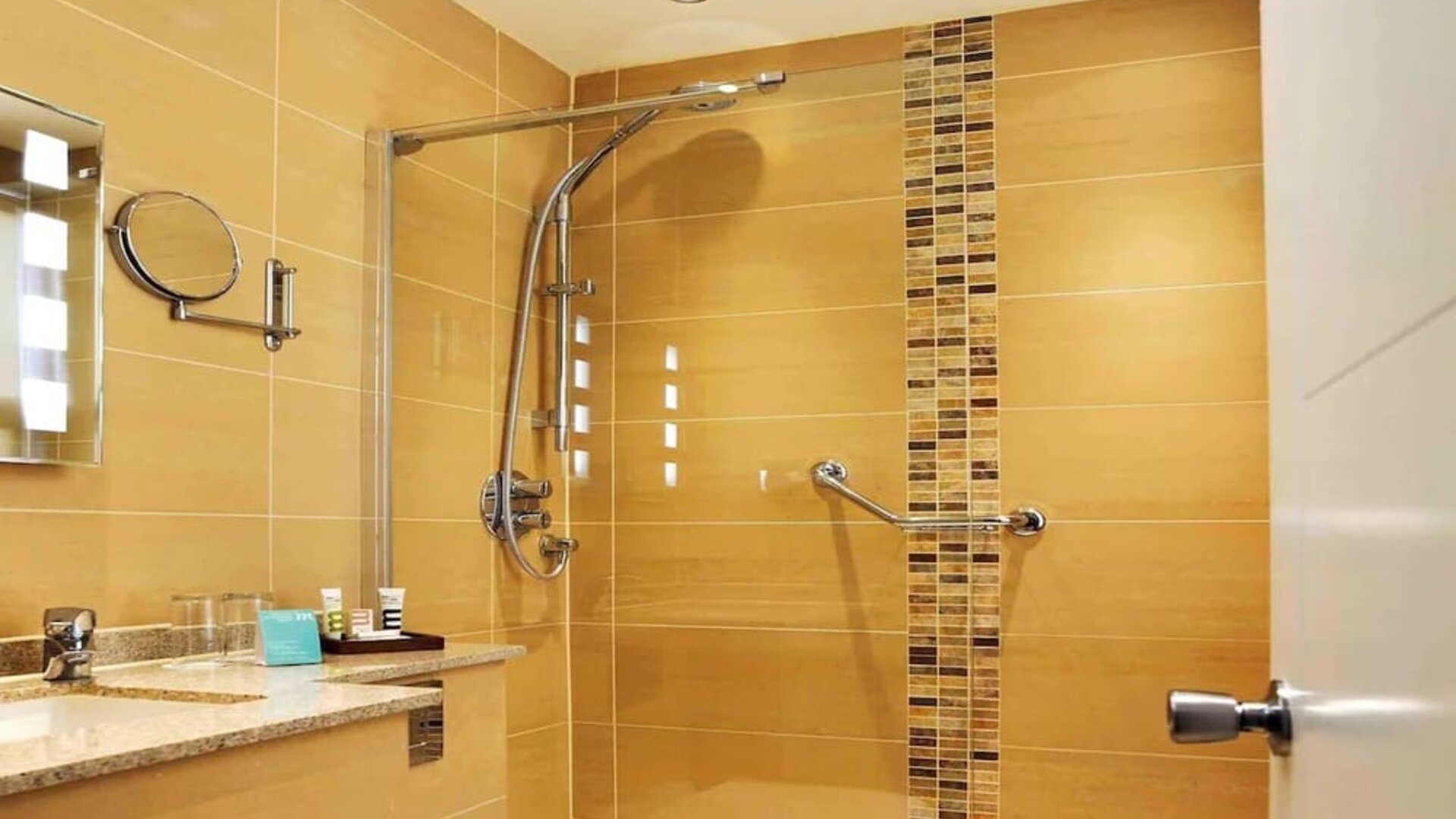Guest bathroom with shower at Mercure London Bloomsbury.