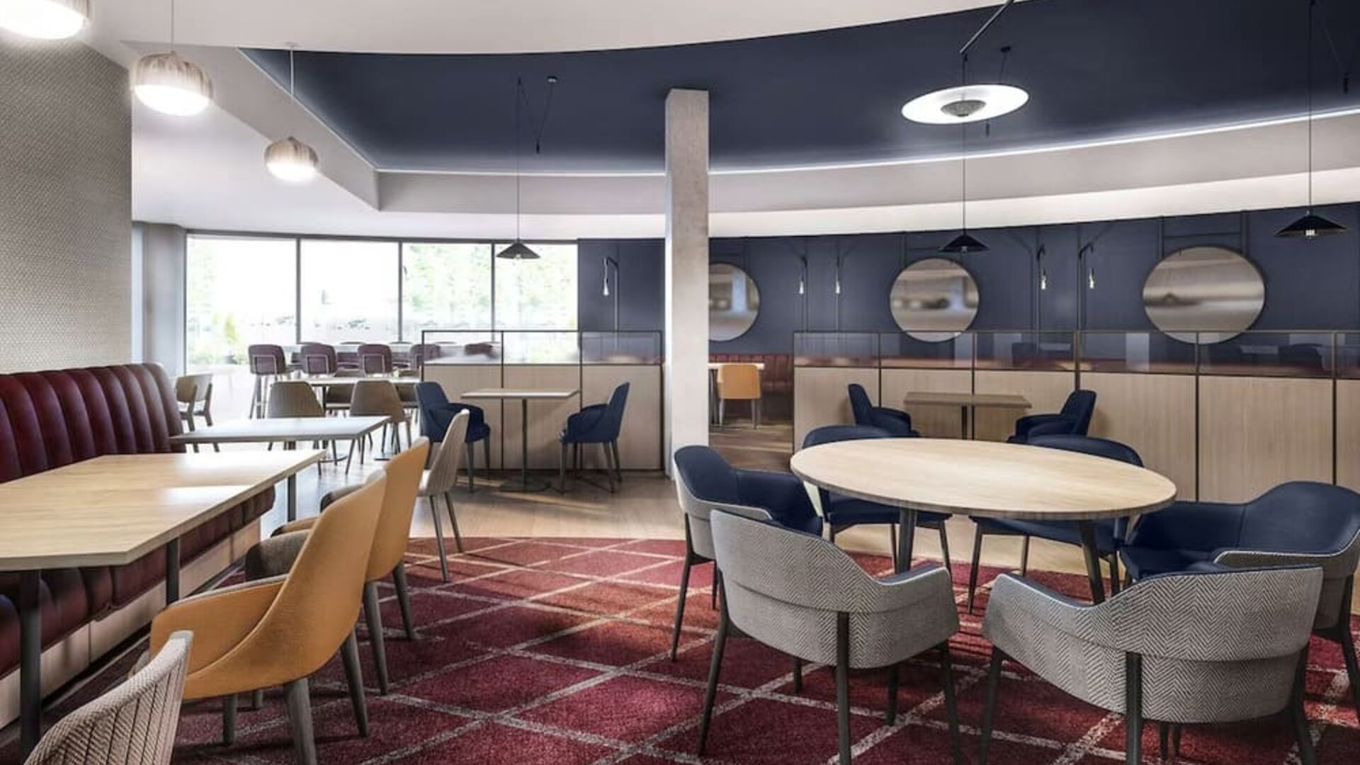 Dining area with comfortable seating, perfect for co-working at Hyatt Place London Heathrow Airport.