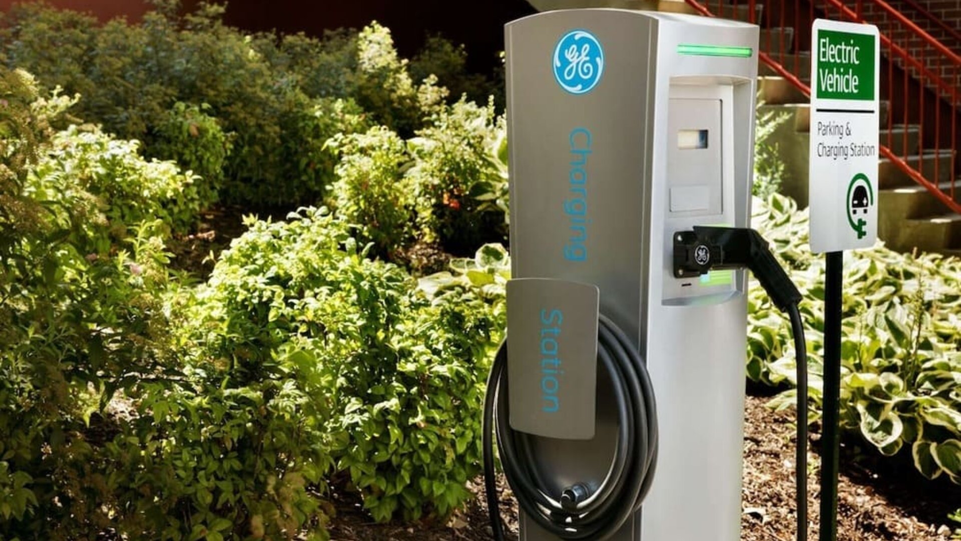 Car charging station and parking at Hampton Inn New York - LaGuardia Airport.