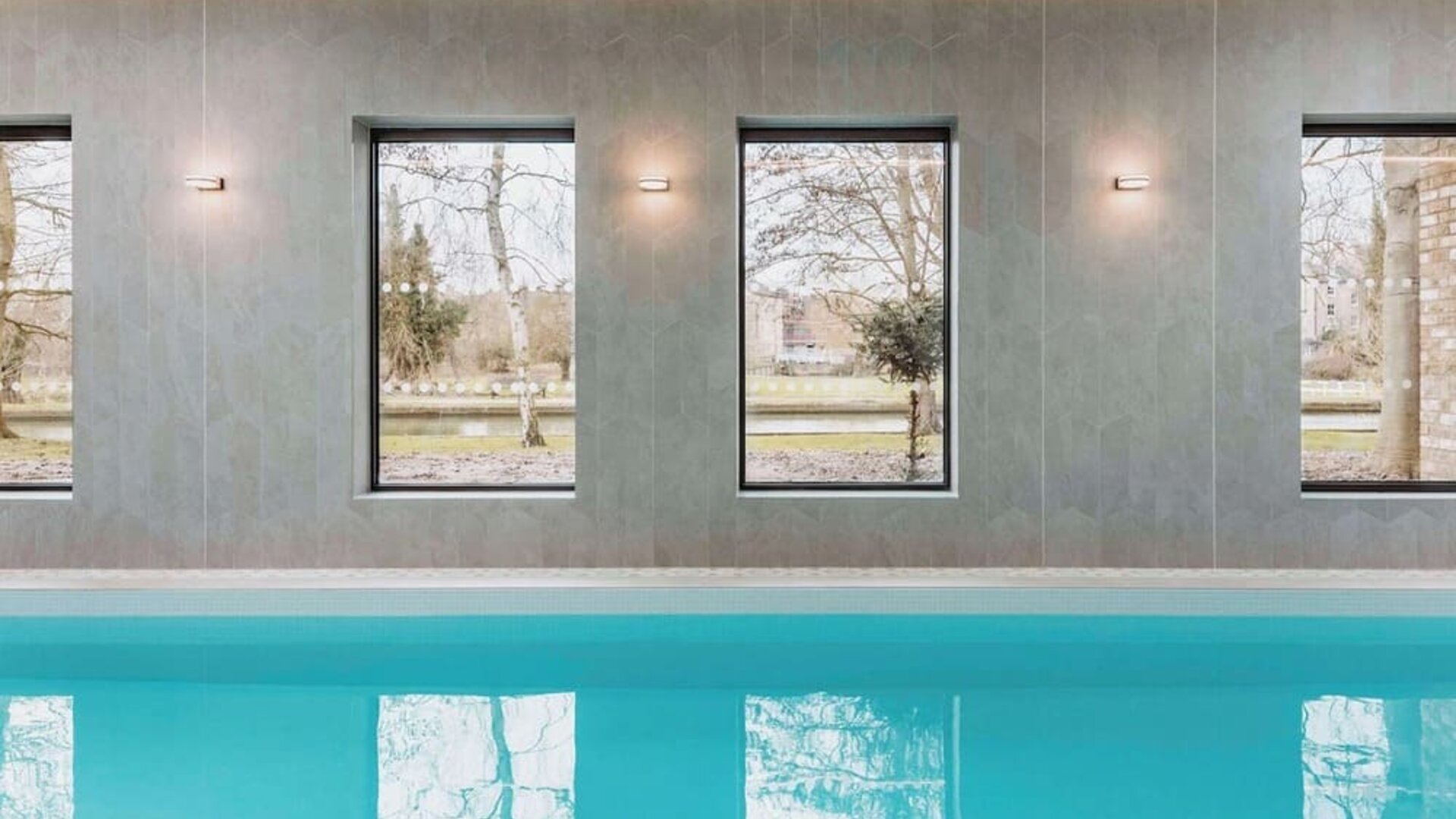 Indoor pool area at Graduate By Hilton Cambridge.