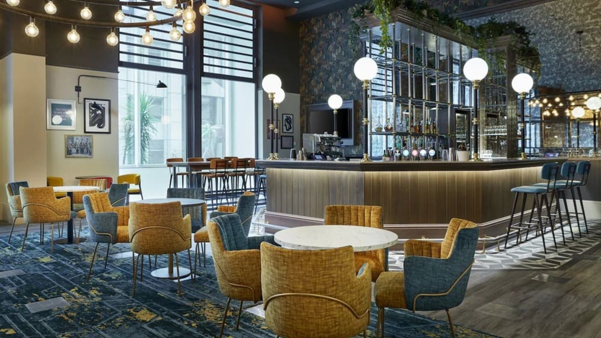 Hotel bar with comfortable seating, perfect for co-working at Leonardo Royal Hotel London Tower Bridge.