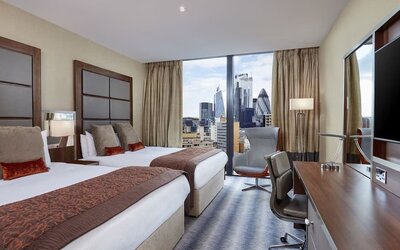 Day use twin room with work desk at Leonardo Royal Hotel London Tower Bridge.