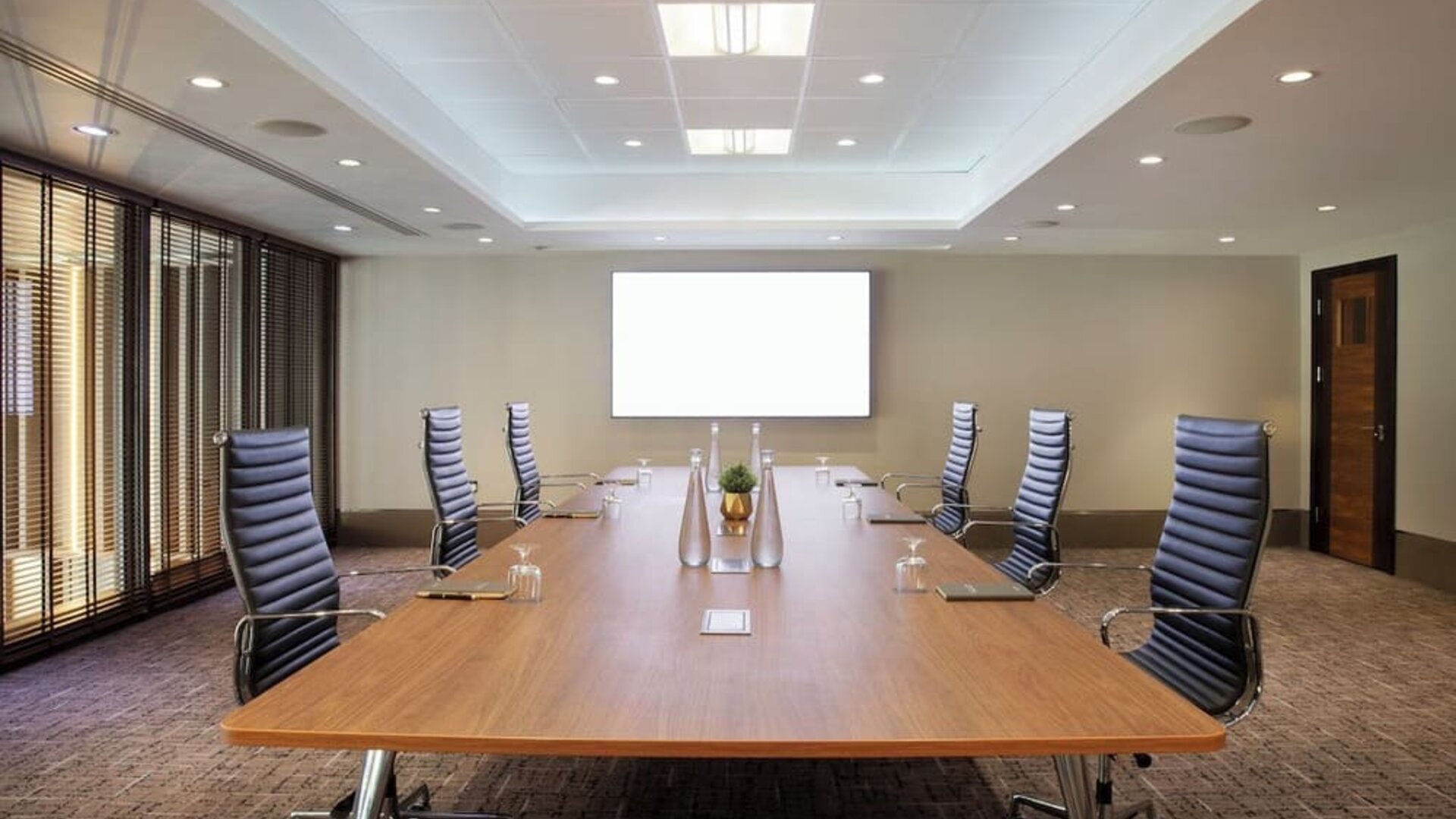 Professional meeting room with ergonomic chairs at Leonardo Royal Hotel London Tower Bridge.