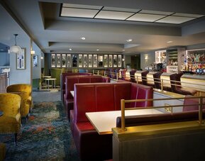 Hotel bar with comfortable seating, perfect for co-working at Leonardo Royal Hotel London City.