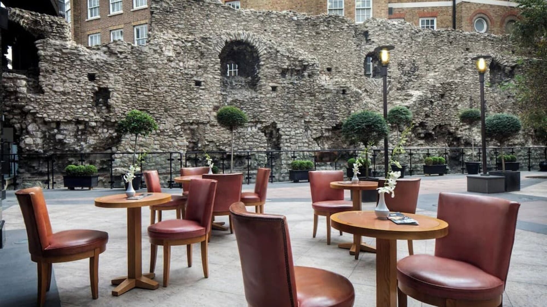 Beautiful hotel terrace with comfortable seating, perfect for co-working at Leonardo Royal Hotel London City.