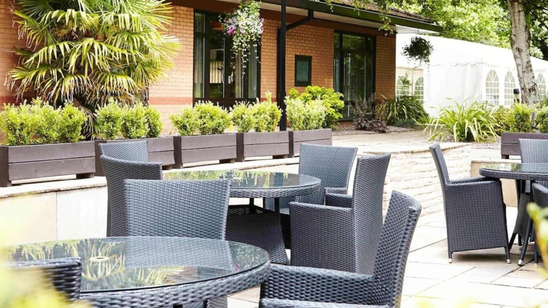 Hotel terrace with comfortable seating at Novotel Manchester West.