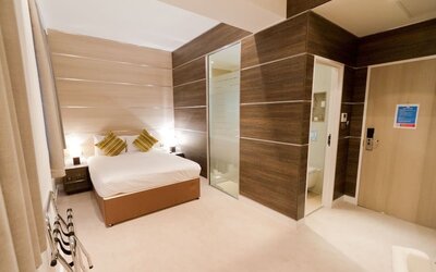 Bright and spacious day use room with private bathroom and workspace at The Wesley Euston Hotel.