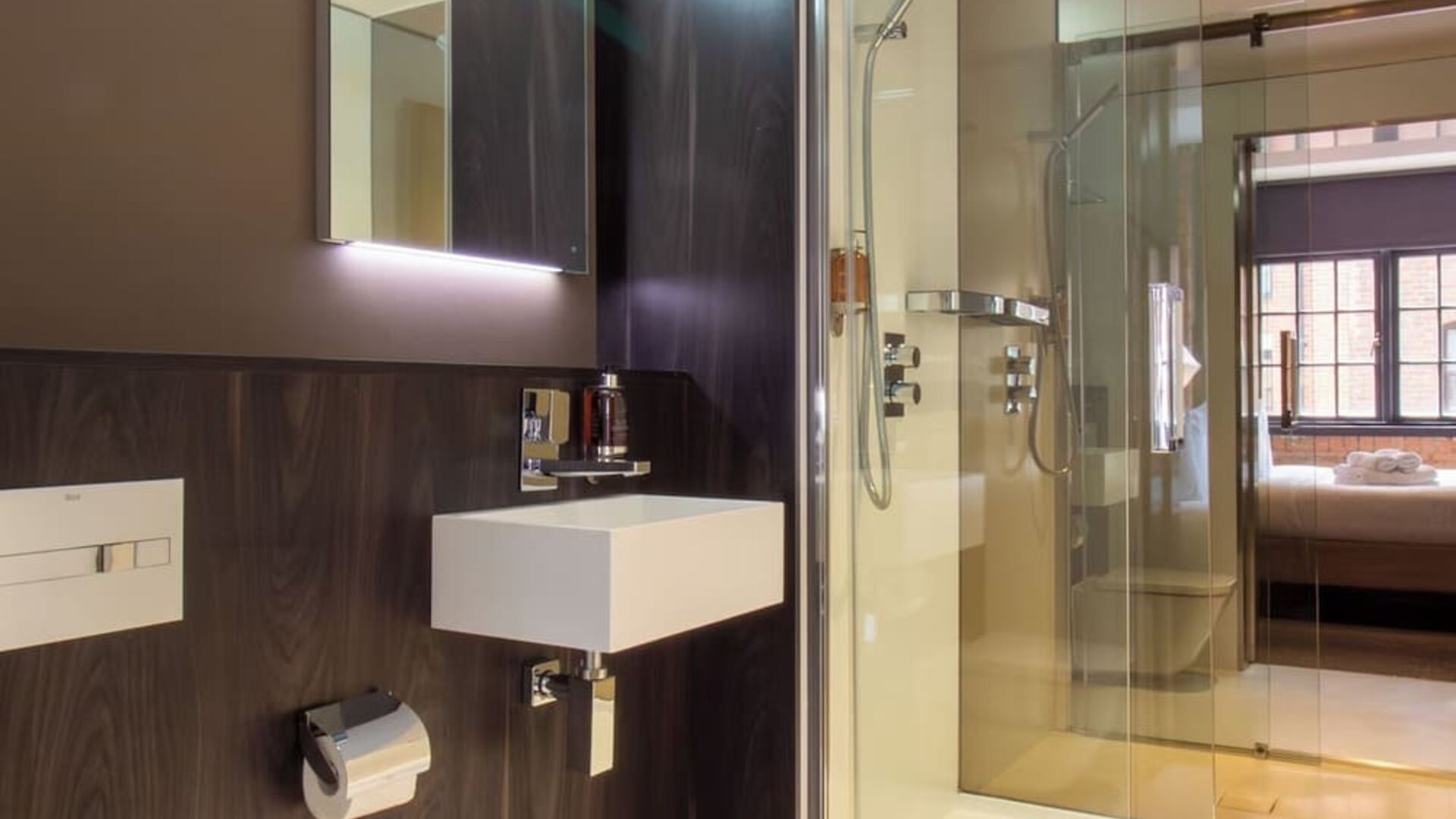 Guest bathroom with shower and free toiletries at Bloc Hotel Birmingham.