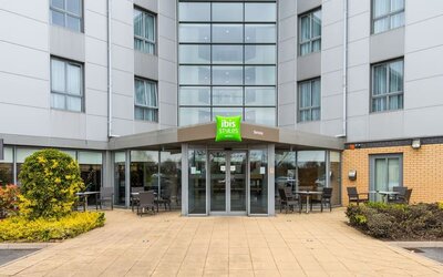Hotel entrance with exterior lounge seating at Ibis Styles Barnsley.