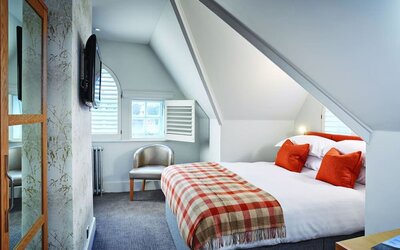 Day use room with TV screen and private bathroom at Barnett Hill Hotel.