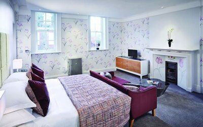 Day use room with king bed and sofa at Barnett Hill Hotel.