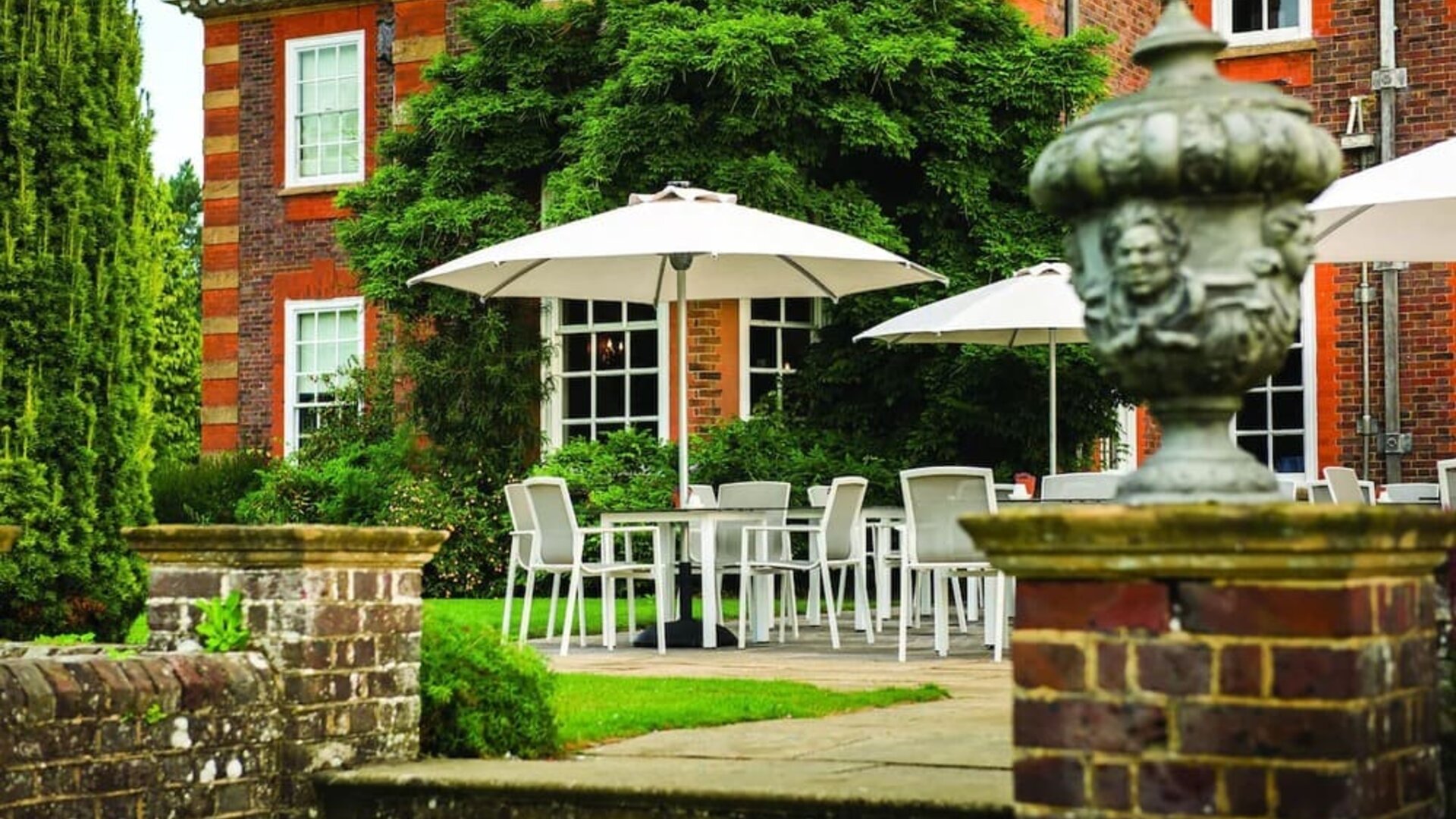 Outdoor lounge with beautiful view of the garden at Barnett Hill Hotel.
