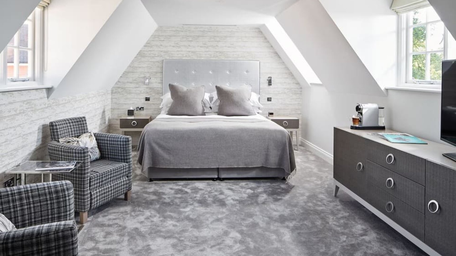 Bright and spacious day use suite with lounge seating and coffee maker at Barnett Hill Hotel.