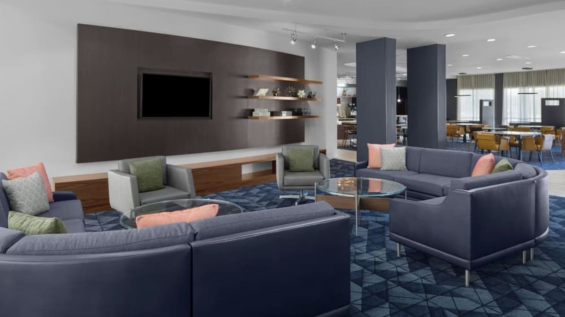 Lobby and coworking lounge at Courtyard By Marriott Tampa Oldsmar.