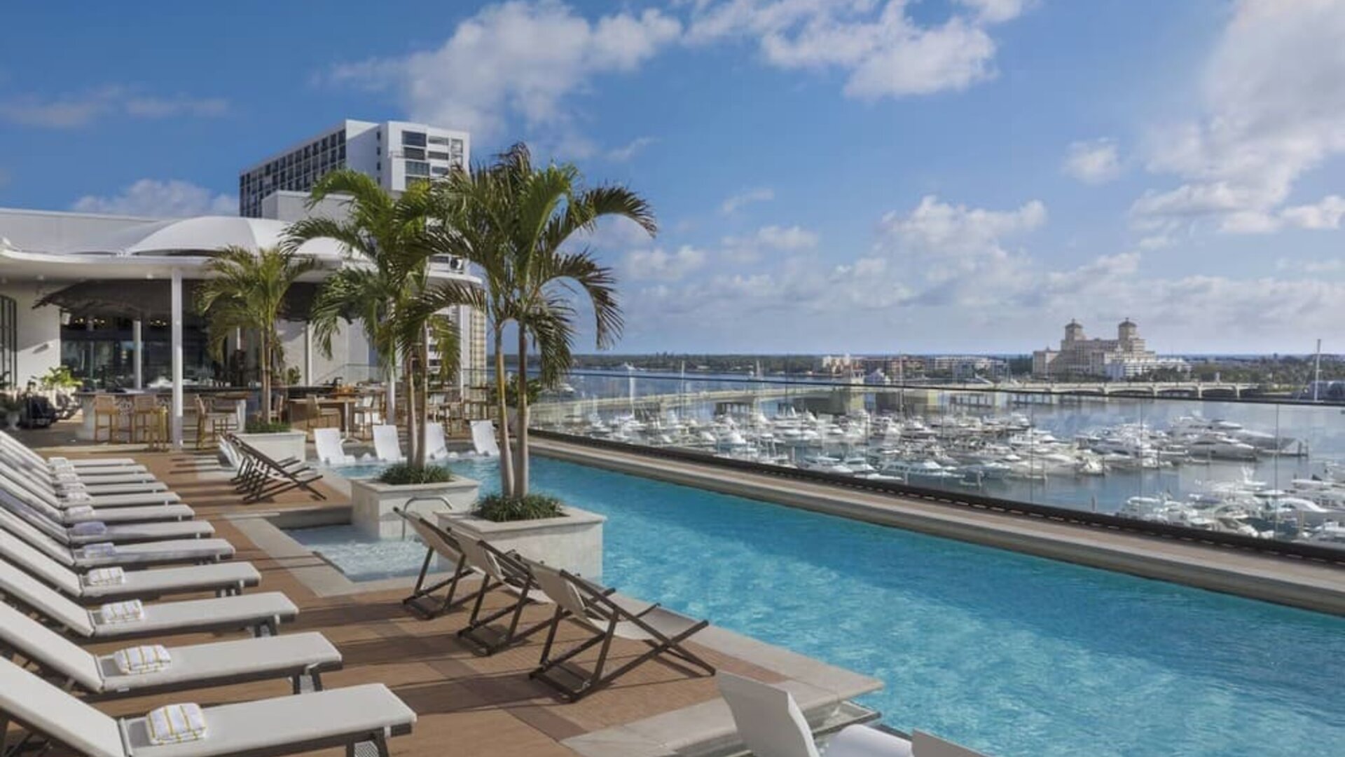 Refreshing outdoor pool with a view of the ocean at The Ben, Autograph Collection.